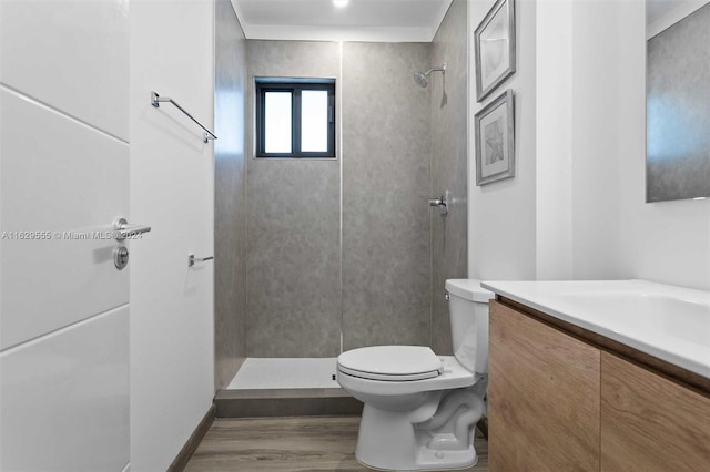 bathroom with walk in shower, vanity, wood-type flooring, and toilet