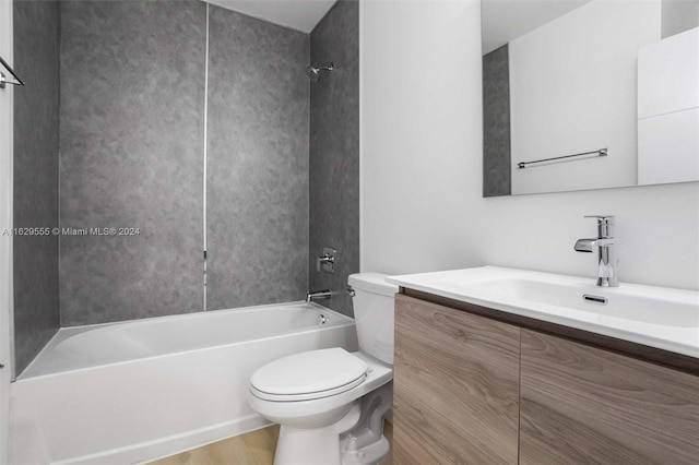 full bathroom featuring bathing tub / shower combination, hardwood / wood-style flooring, vanity, and toilet