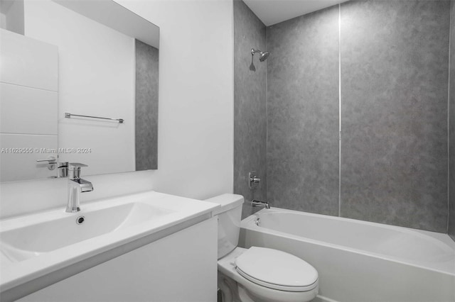 full bathroom with bathing tub / shower combination, vanity, and toilet