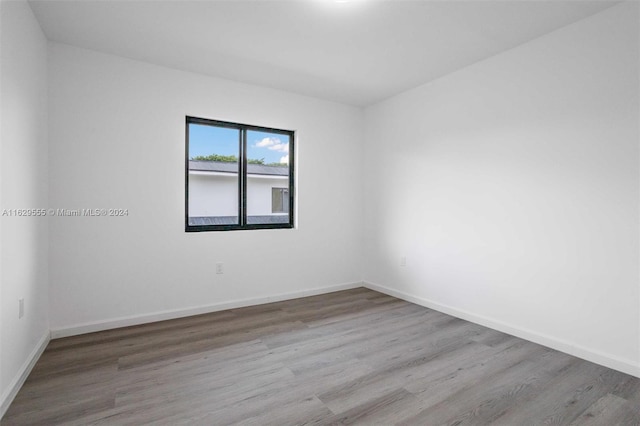 spare room featuring light wood-type flooring