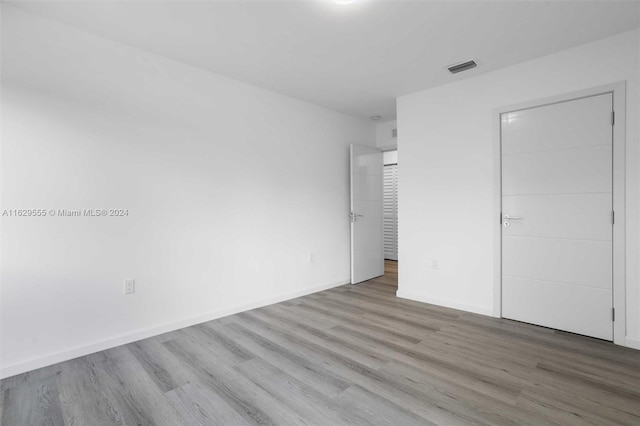 unfurnished bedroom with light wood-type flooring