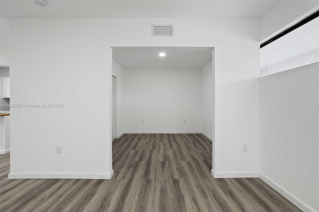 spare room with dark hardwood / wood-style floors