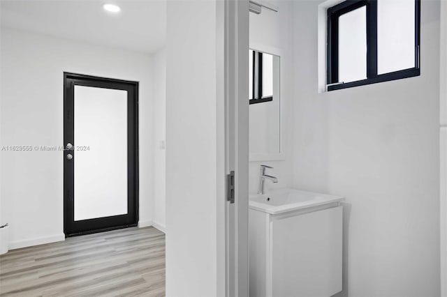 bathroom featuring vanity and hardwood / wood-style flooring