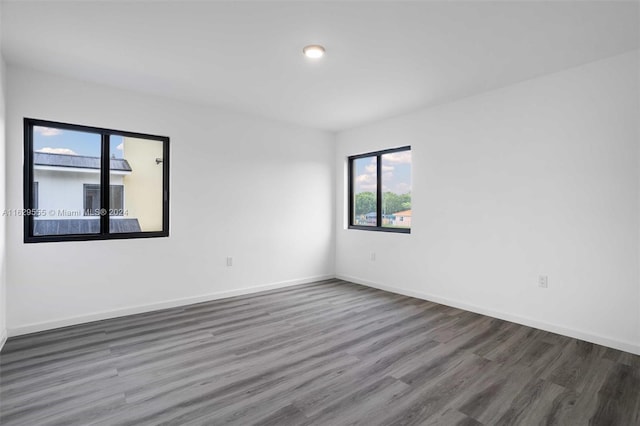 empty room featuring dark hardwood / wood-style floors