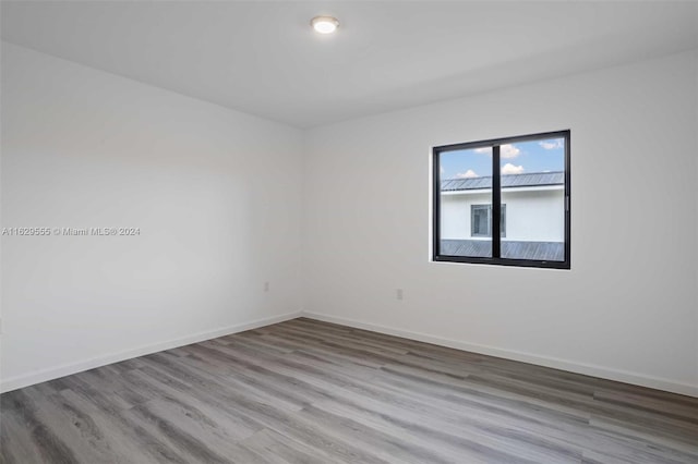 unfurnished room featuring light hardwood / wood-style floors