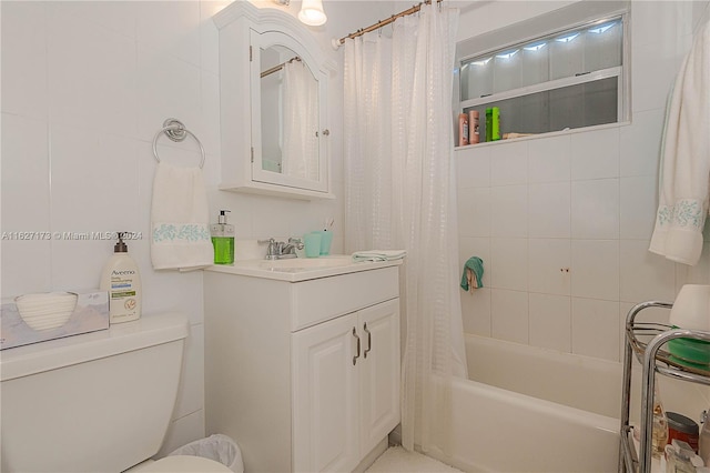 bathroom with shower / bathtub combination with curtain, toilet, and vanity