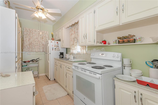 kitchen featuring light tile patterned floors, white appliances, a ceiling fan, white cabinets, and light countertops