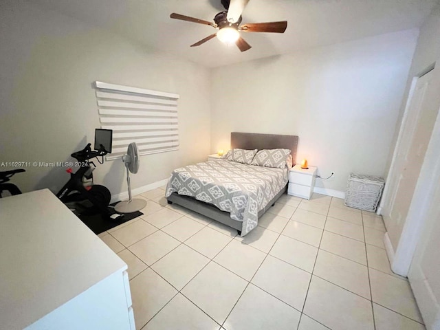 bedroom with light tile patterned floors and ceiling fan