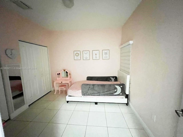 bedroom featuring light tile patterned floors