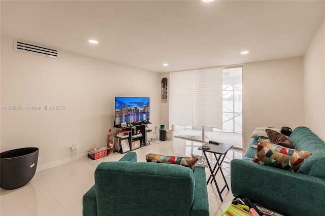 living room featuring a wall of windows