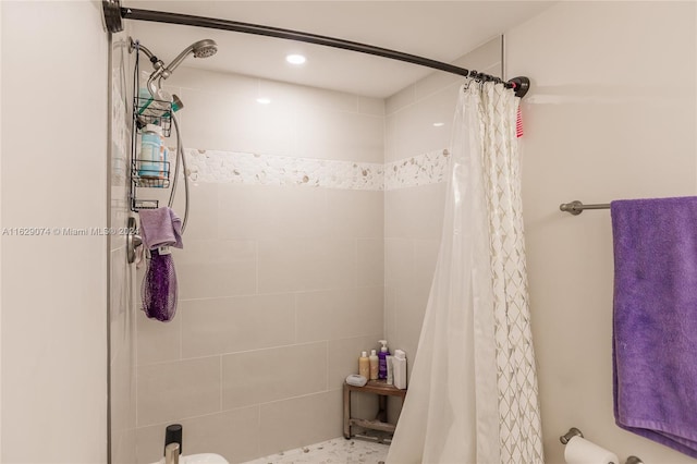 bathroom with a shower with shower curtain