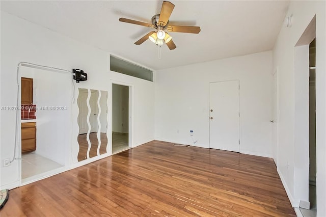 unfurnished bedroom featuring ceiling fan and hardwood / wood-style floors