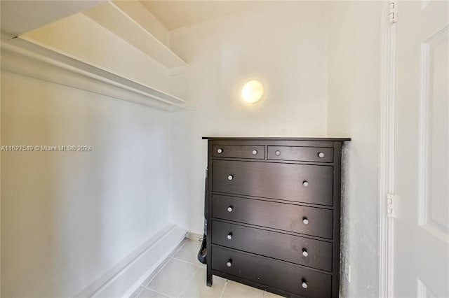 spacious closet featuring light tile patterned floors