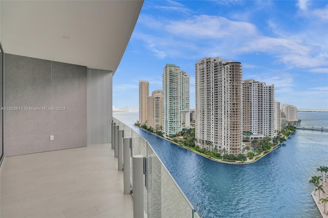 balcony featuring a water view