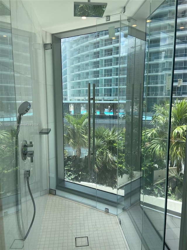 bathroom with a shower and tile patterned floors