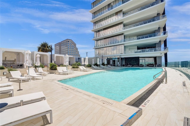 view of swimming pool with a patio