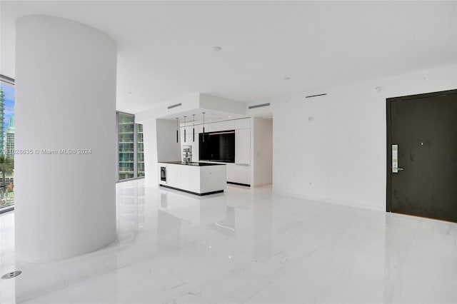 unfurnished living room with plenty of natural light