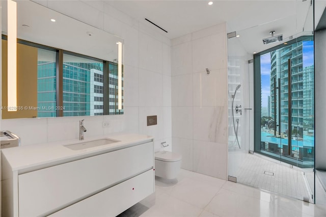 bathroom featuring tile patterned floors, toilet, a shower, tile walls, and vanity