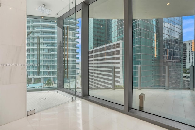 interior space with expansive windows and tile patterned floors