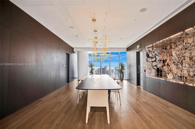 dining area with hardwood / wood-style floors