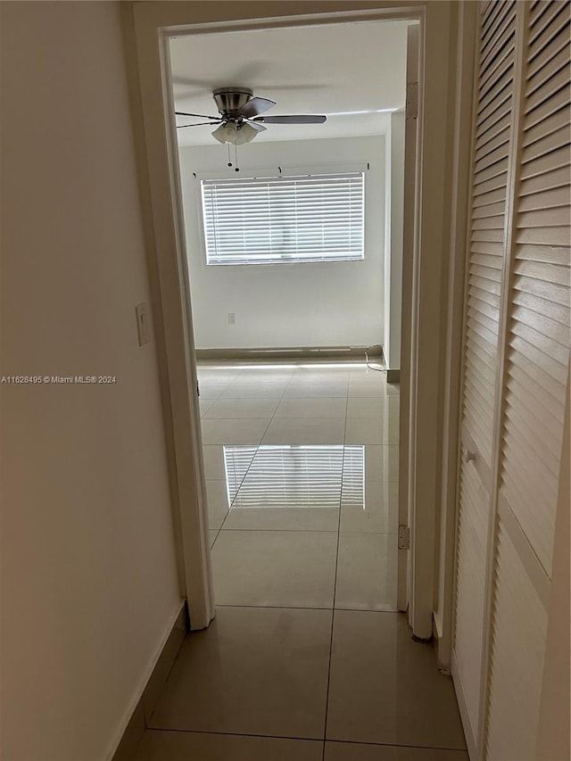 hallway featuring light tile patterned flooring