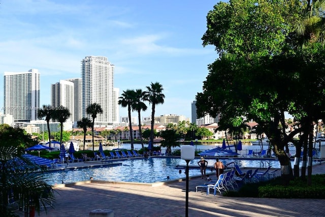 view of pool with a water view