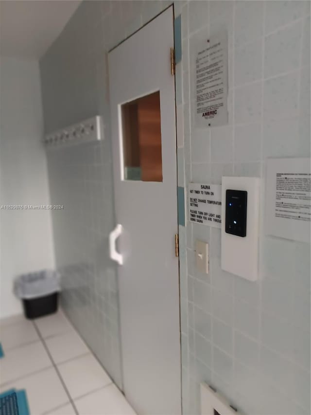 bathroom with tile walls