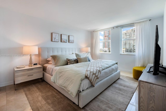 bedroom featuring baseboards