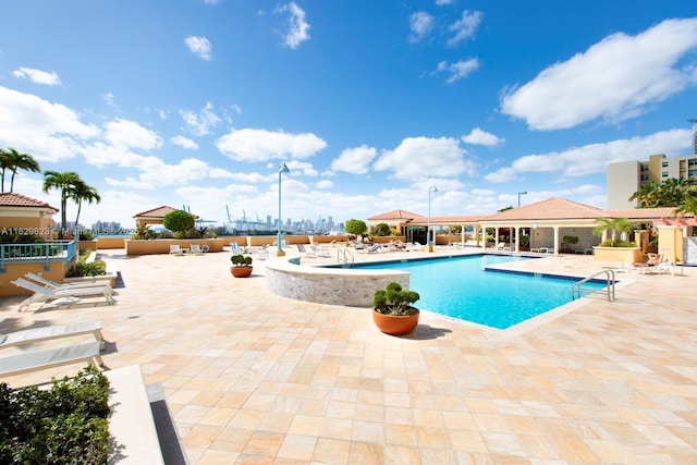 community pool with a patio area