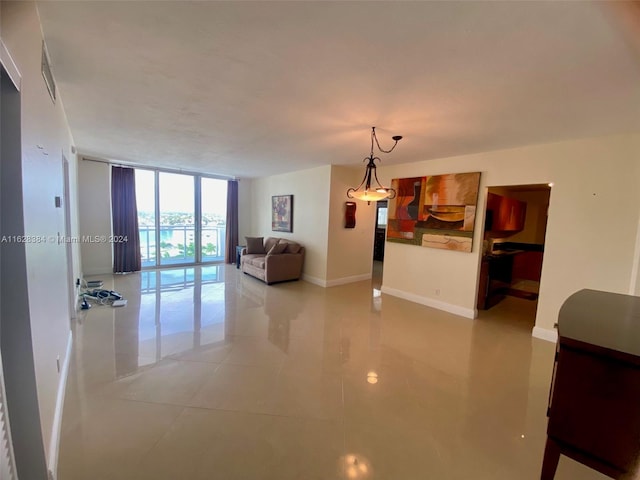 tiled living room with a wall of windows