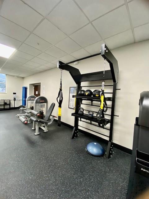 exercise room featuring a drop ceiling