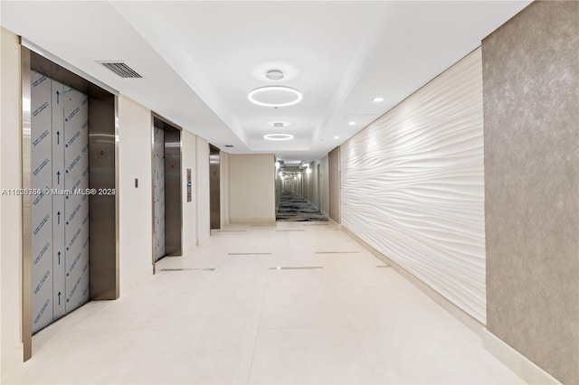 corridor with light tile patterned floors