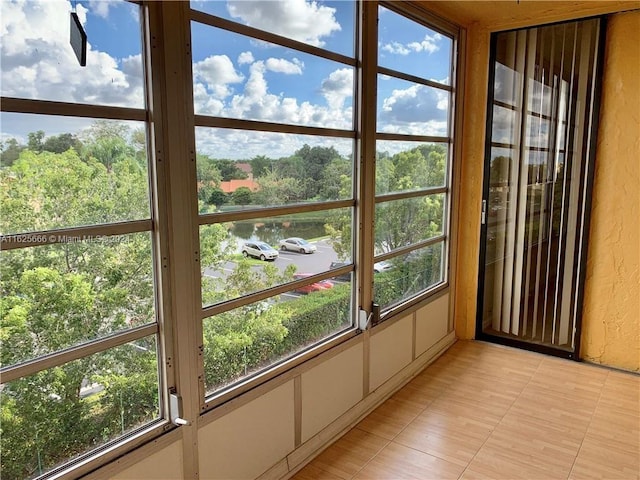 unfurnished sunroom featuring plenty of natural light