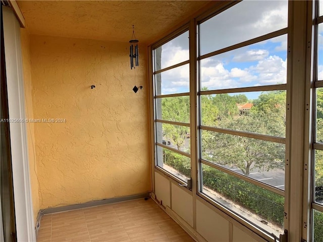 unfurnished sunroom with a healthy amount of sunlight