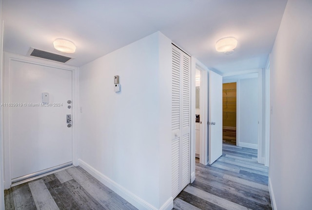 corridor featuring hardwood / wood-style flooring