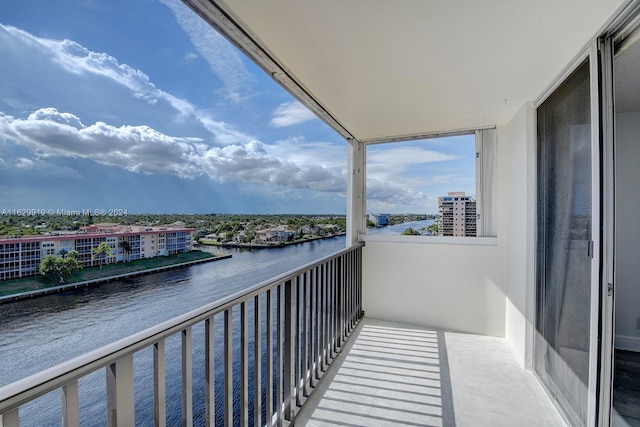 balcony featuring a water view