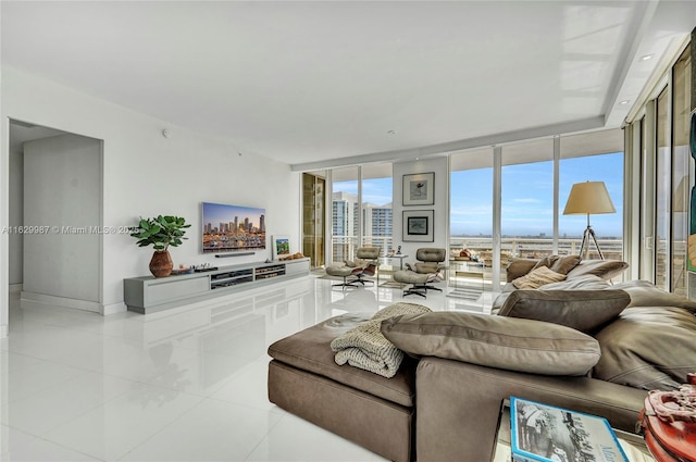 living room with light tile patterned floors and expansive windows