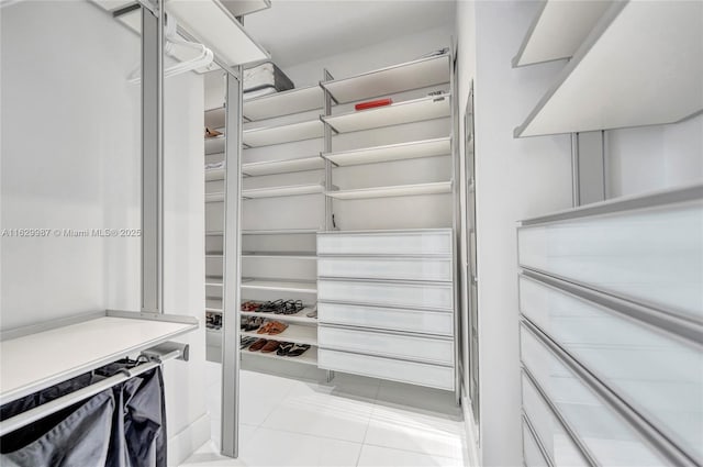 walk in closet featuring light tile patterned floors