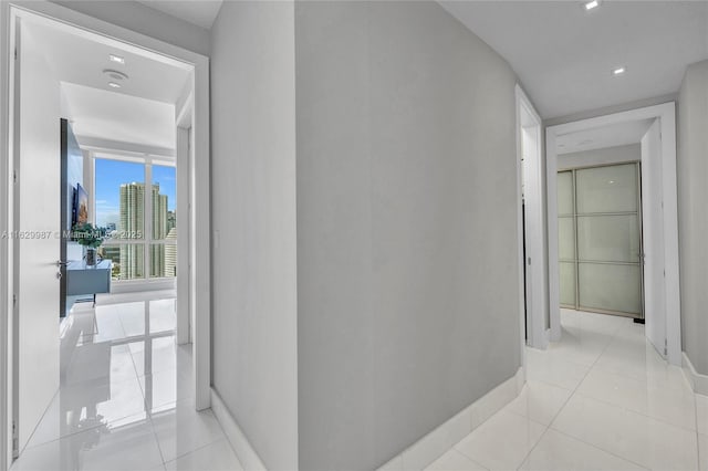 hallway featuring light tile patterned flooring