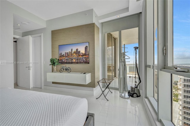 bedroom featuring tile patterned flooring and access to outside