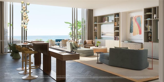 living room with a water view, a wealth of natural light, and expansive windows