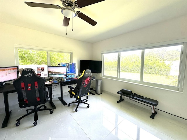 tiled office space with ceiling fan