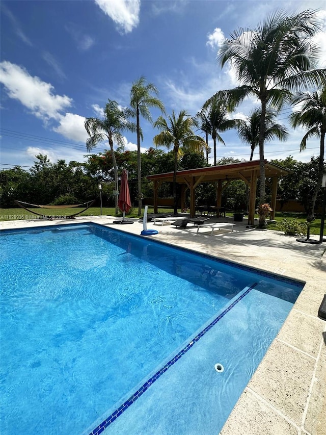 view of pool featuring a gazebo and a patio