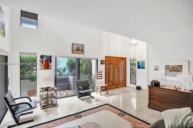 bedroom featuring a towering ceiling