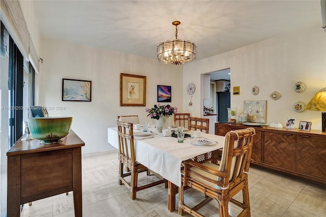 dining room featuring a notable chandelier