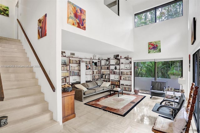 living room with a towering ceiling