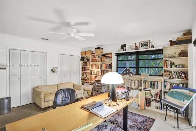 interior space with ceiling fan