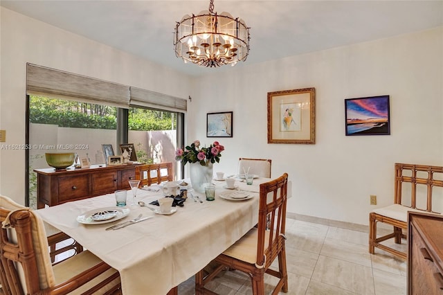 tiled dining area featuring a notable chandelier