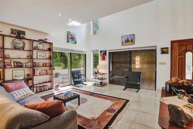 tiled living room with a high ceiling