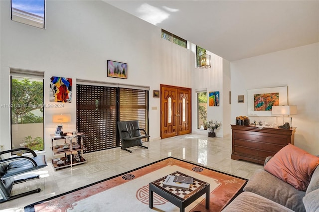 living room featuring a towering ceiling